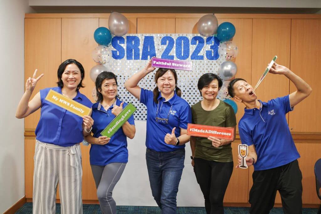 Staff had a whale of a time taking pictures at the photo booth corner