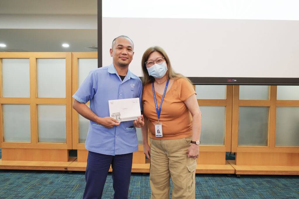Staff receiving their awards