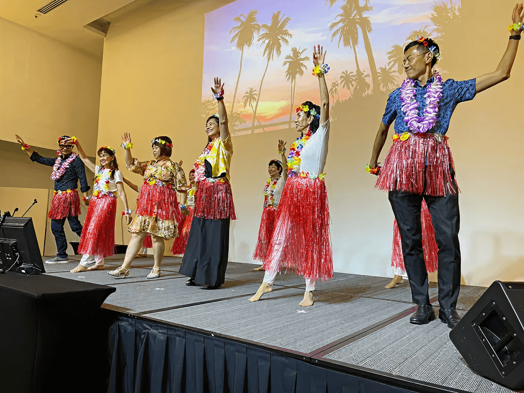 What's a Hawaii-themed party without some hula dancing? Cavin and Eugene joined seniors to bust out some hip-swaying hula moves to Teresa Teng's 'Nan Hai Gu Niang' (Girl By The Southern China Sea)