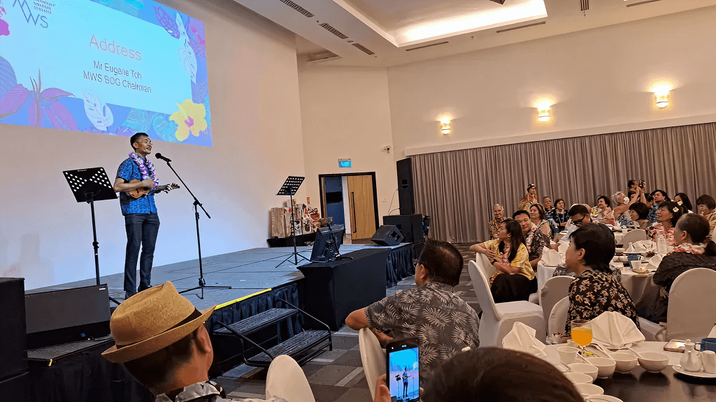 Eugene serenades with "Somewhere Over the Rainbow" - a song that he revealed was recommended by ChatGPT to fit the Hawaiian theme - while strumming a ukulele